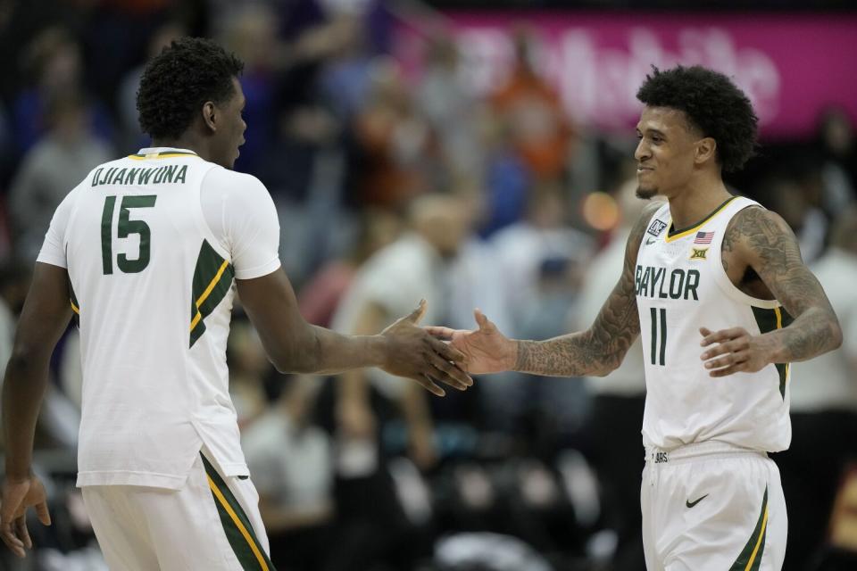 Baylor forward Jalen Bridges celebrates with forward Josh Ojianwuna after making a shot at the buzzer.