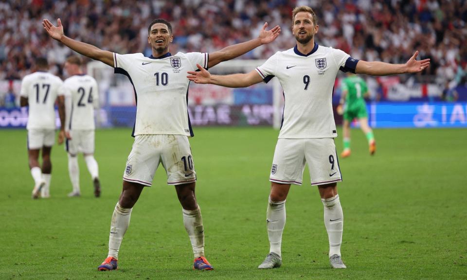 <span>Jude Bellingham and Harry Kane celebrate the former’s spectacular late equaliser.</span><span>Photograph: Adrian Dennis/AFP/Getty Images</span>