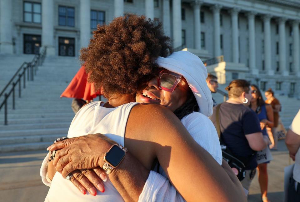 Rae Duckworth, Black Lives Matter Utah Chapter operating chairperson, hugs Betty Sawyer, Project Success Coalition executive director and Ogden NAACP president, during a vigil to honor Americans who died because they were Black, on the 60th anniversary of the March on Washington for Jobs and Freedom, in front of the Capitol in Salt Lake City on Monday.