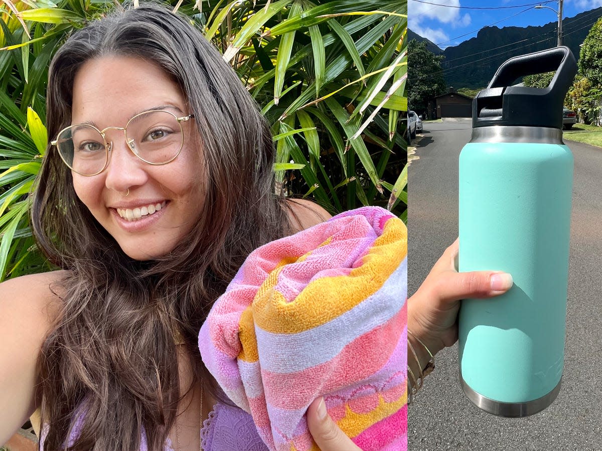 Selfie of the writer holding a pink, orange, and purple beach towel; The writer holds a blue reusable water bottle in front of Hawaiian neighborhood