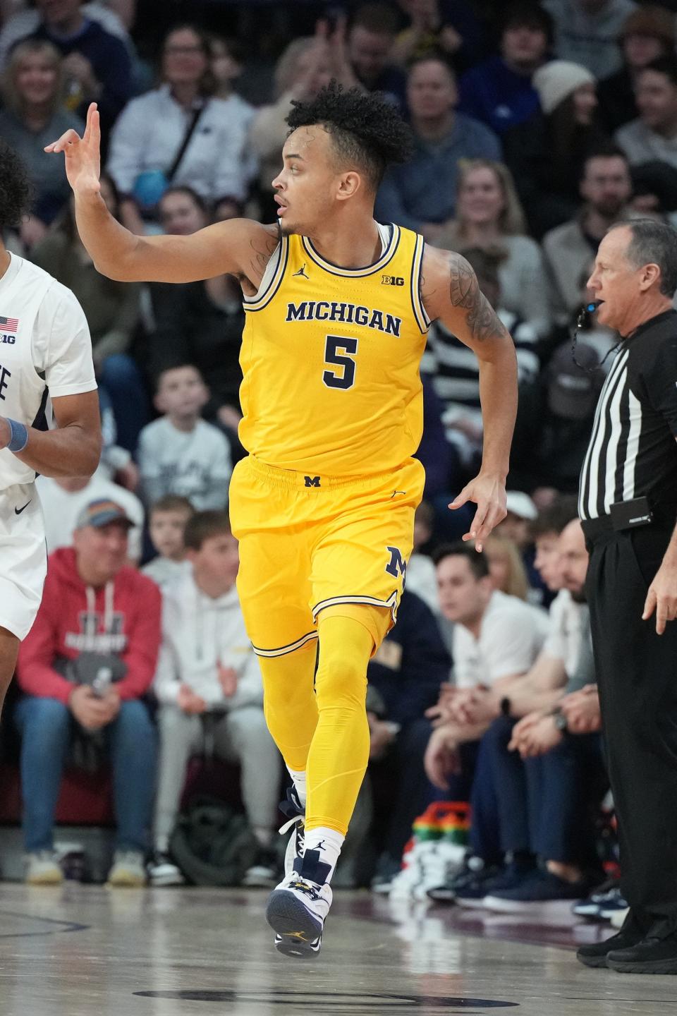 Terrance Williams II of the Michigan Wolverines celebrates a shot against the Penn State Nittany Lions in the first half at the Palestra on Jan. 7, 2024, in Philadelphia, Pa.