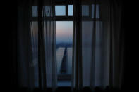 The North Korean side of the Yalu River and the Broken Bridge, bombed by U.S. forces in the Korean War and now a tourist site, are seen from a hotel room in Dandong, China's Liaoning province, April 2, 2017. REUTERS/Damir Sagolj