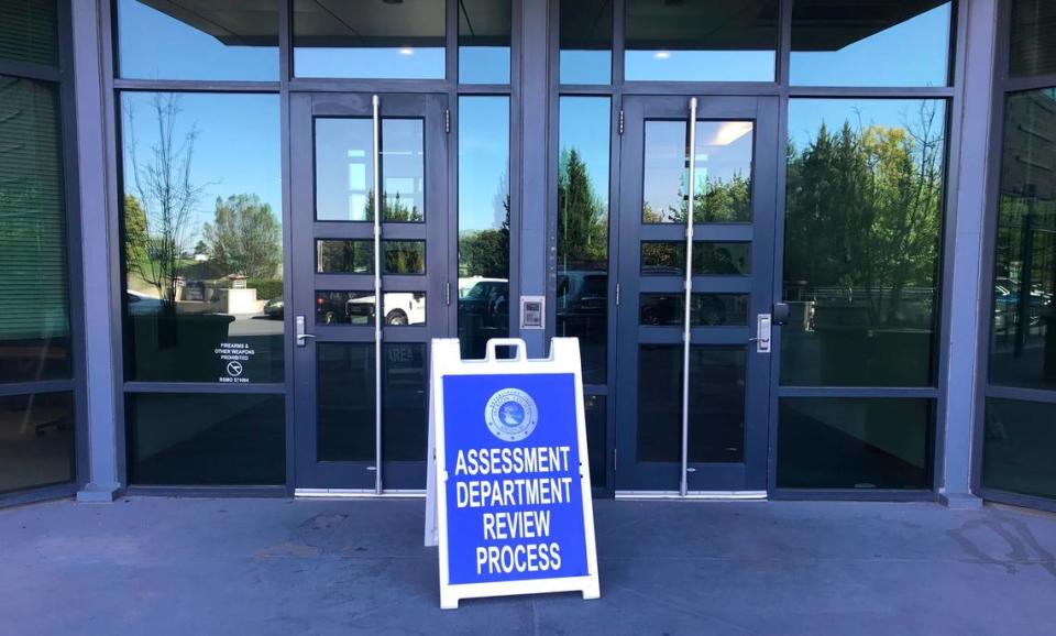 A sign marking the location of the Jackson County Assessment Office’s property valuation review process is seen outside the south entrance to 1300 Washington in downtown Kansas City on Wednesday, May 3, 2023.