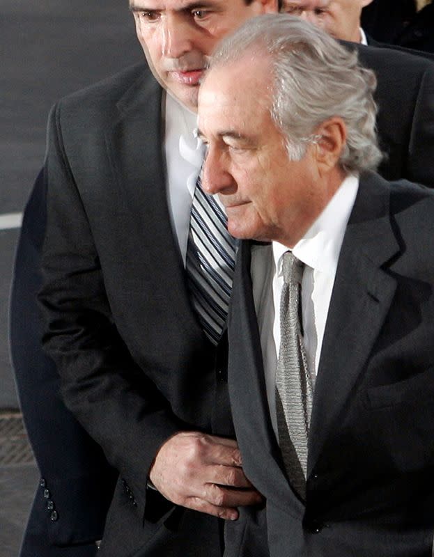 FILE PHOTO: Accused swindler Bernard Madoff enters the Manhattan federal court house in New York