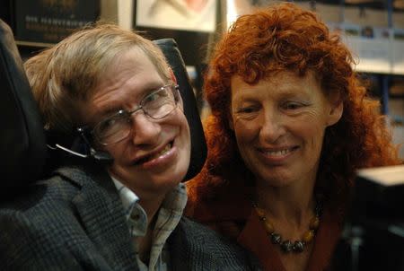 FILE PHOTO: British astrophysicist Professor Stephen Hawking and his wife Elaine (R) visit the stand of German bookseller Rowohlt at the Frankfurt book fair, October 19, 2005. REUTERS/Alex Grimm/File Photo