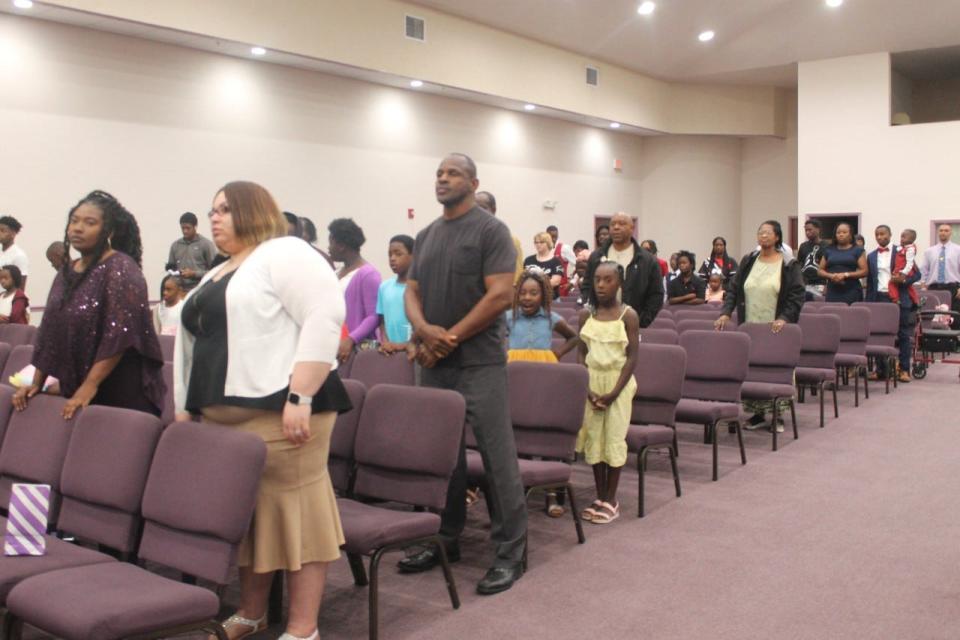 Parishioners attending the Easter Sunday morning worship service at Upper Room Ministries in northeast Gainesville stand to give honor, praise and glory to Jesus Christ.
(Photo: Photo by Voleer Thomas/For The Guardian)