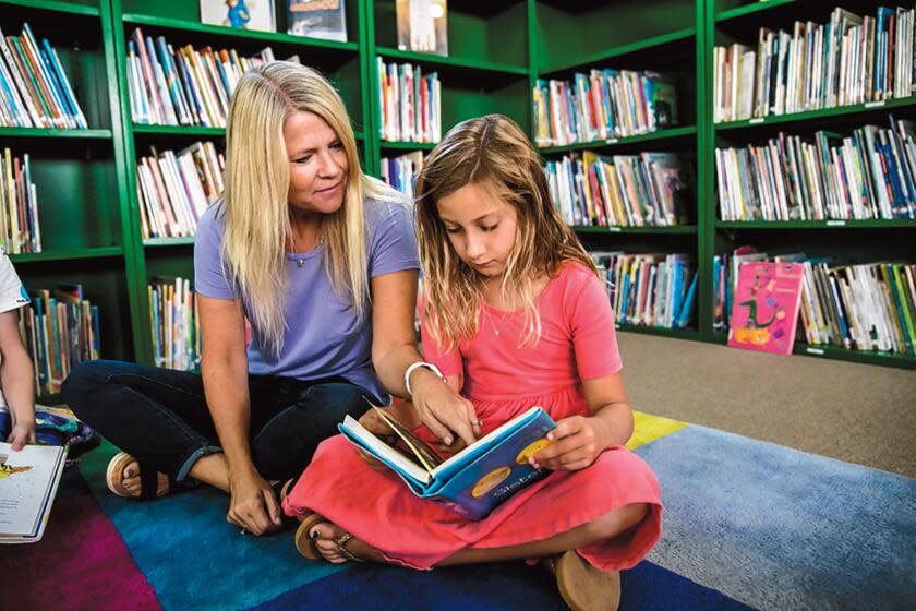 A teacher shares reading strategies at The Children's School in La Jolla.