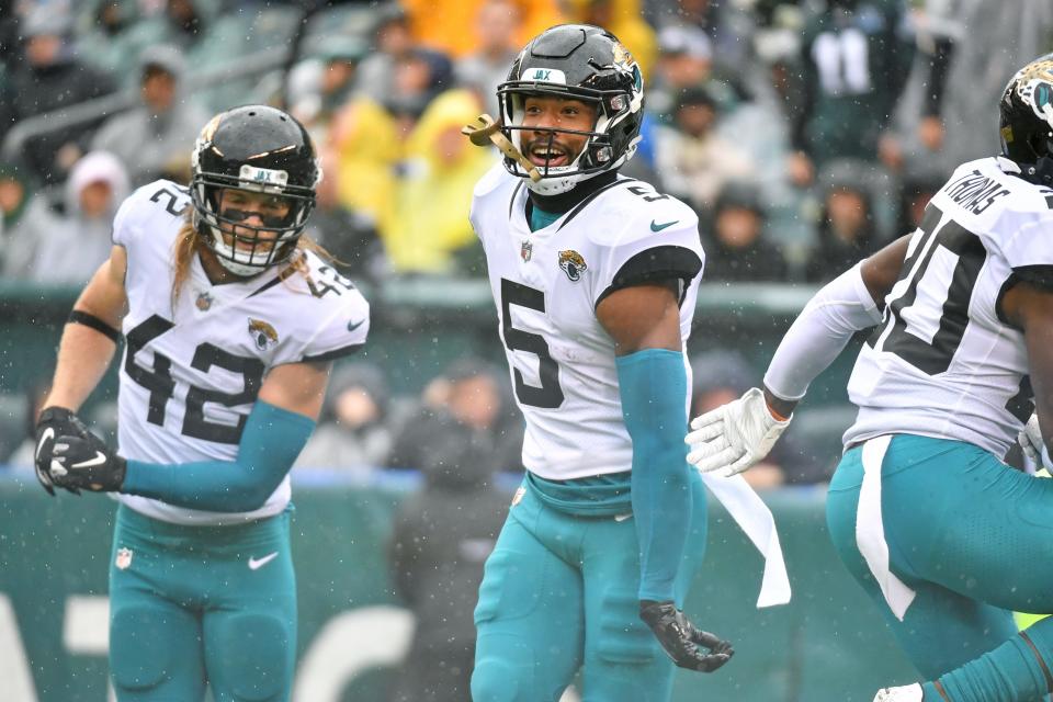 Oct 2, 2022; Philadelphia, Pennsylvania, USA; Jacksonville Jaguars safety Andre Cisco celebrates his interception return for a touchdown with teammates against the  Philadelphia Eagles during the first quarter at Lincoln Financial Field. Mandatory Credit: Eric Hartline-USA TODAY Sports