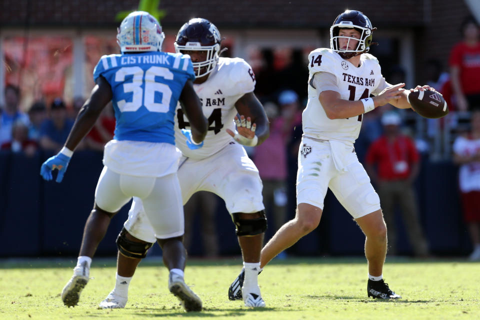 Nov 4, 2023; Oxford, Mississippi, USA; Texas A&M Aggies quarterback Max Johnson (14) passes the ball against the Mississippi Rebels during the second half at Vaught-Hemingway Stadium. Mandatory Credit: Petre Thomas-USA TODAY Sports