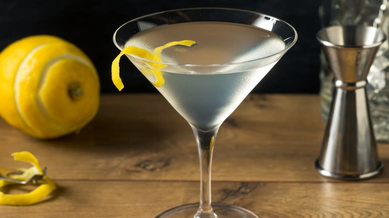 A Holland House cocktail garnished with lemon peel in a martini glass 
