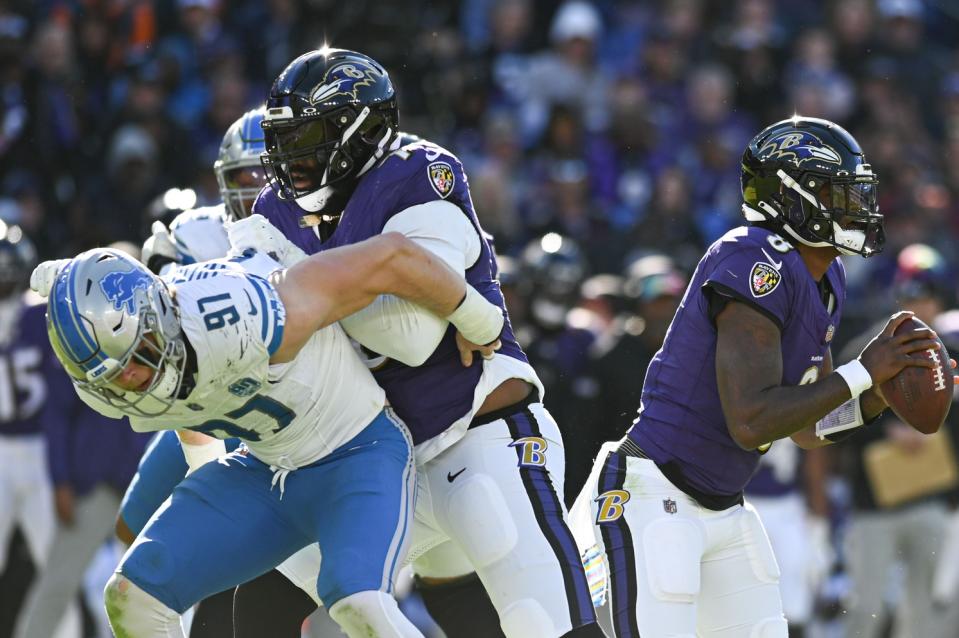 Oct 22, 2023; Baltimore, Maryland, USA; Baltimore Ravens offensive tackle Ronnie Stanley (79) blocks Detroit Lions defensive end Aidan Hutchinson (97) as quarterback Lamar Jackson (8) looks to throw during the second half at M&T Bank Stadium. Mandatory Credit: Tommy Gilligan-USA TODAY Sports