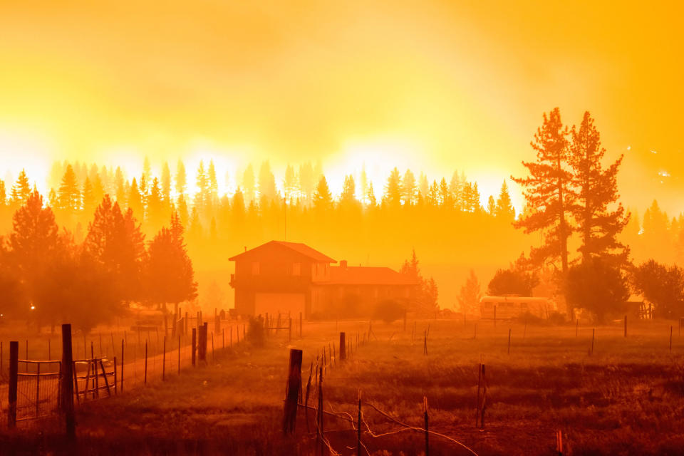 A cloud of fire and smoke fills the air over a house in Markleeville, California, on July, 16.