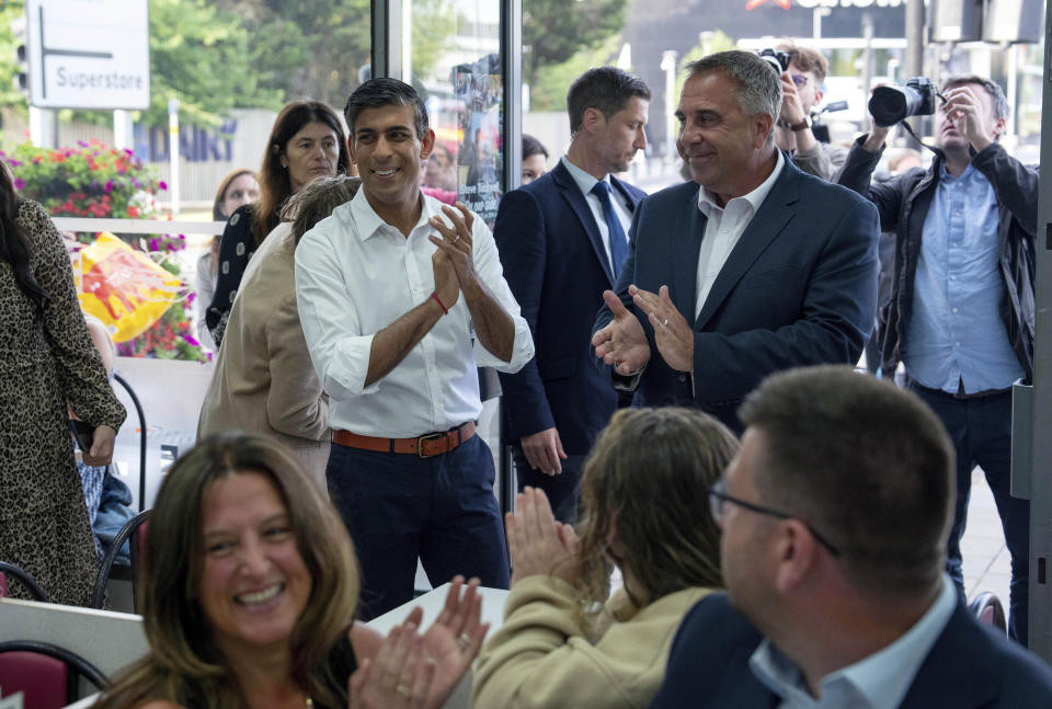 Britain's Prime Minister Rishi Sunak, centre left congratulates newly elected Conservative MP Steve Tuckwell, centre right, after he won the Uxbridge and South Ruislip by-election, in Uxbridge, West London, Friday July 21, 2023. Britain's governing Conservative Party suffered two thumping defeats Friday in a trio of special elections but avoided a drubbing after holding onto former premier Boris Johnson's seat in suburban London. (Carl Court/Pool Photo via AP)