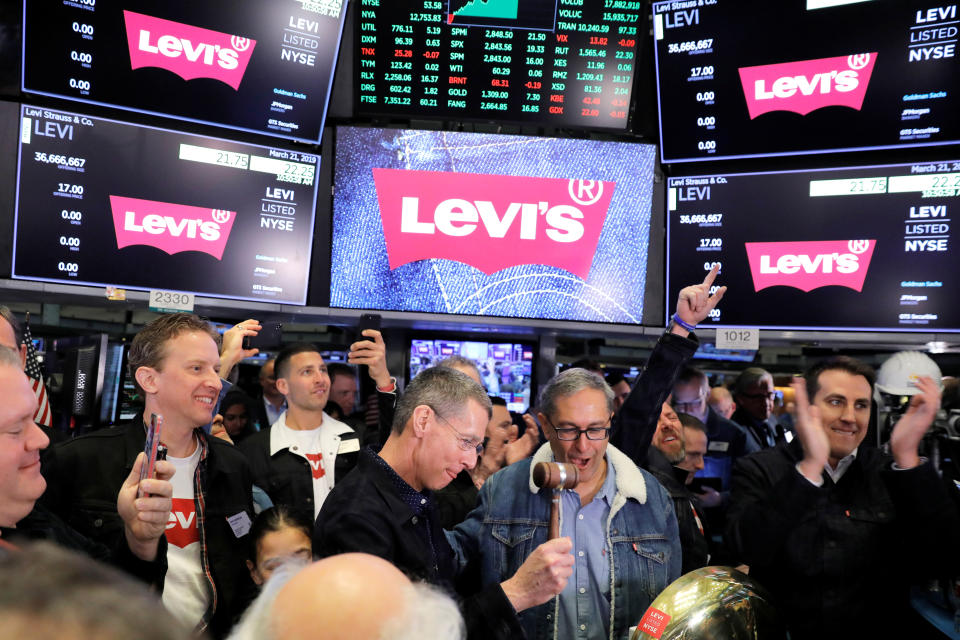 Levi Strauss & Co. CEO Chip Bergh rings a bell as CFO Harmit Singh looks on during the company's IPO on the floor of the New York Stock Exchange (NYSE) in New York, U.S., March 21, 2019. REUTERS/Lucas Jackson