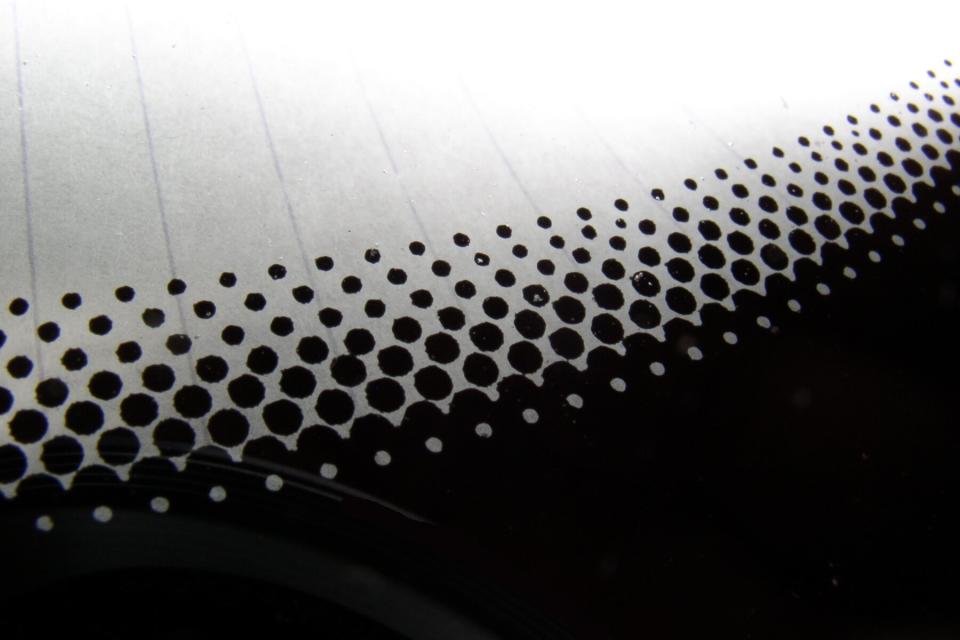 Automobile window detail of black dots