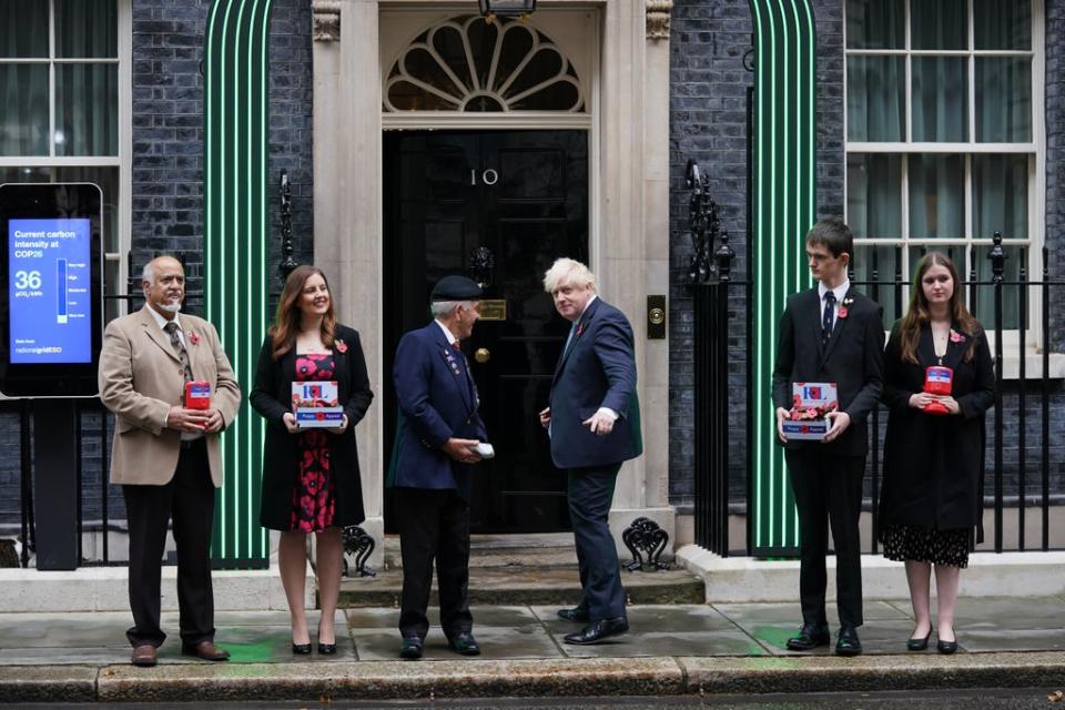 Prime Minister Boris Johnson met five poppy appeal fundraisers outside Number 10 (Steve Parsons/PA) (PA Wire)