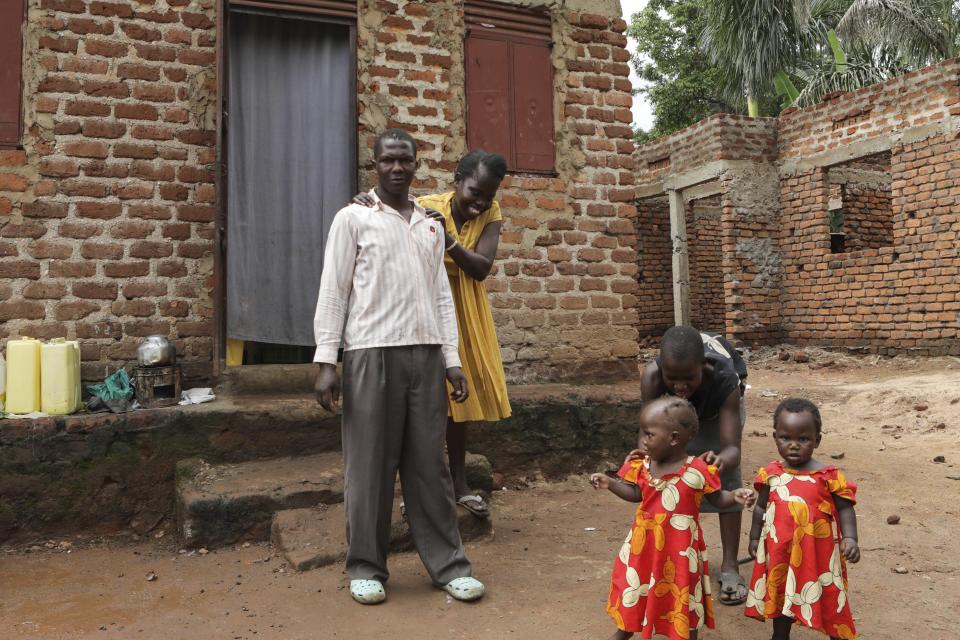 Barbara Nabulo who lives with sickle cell disease jokes with her husband at Busamaga-Mutukula village in Mbale, Uganda, Thursday, April 25, 2024. There can be lifelong challenges for people with sickle cell disease in rural Uganda, where it remains poorly understood. (AP Photo/Hajarah Nalwadda)