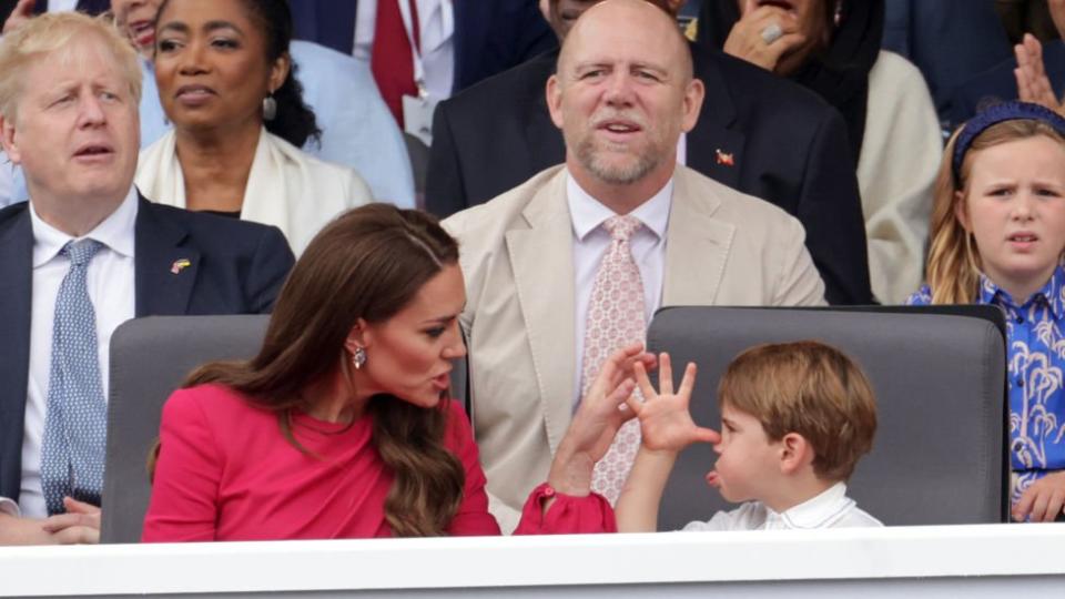 Catherine, Duchess of Cambridge, (L) and Prince Louis of Cambridge (R)