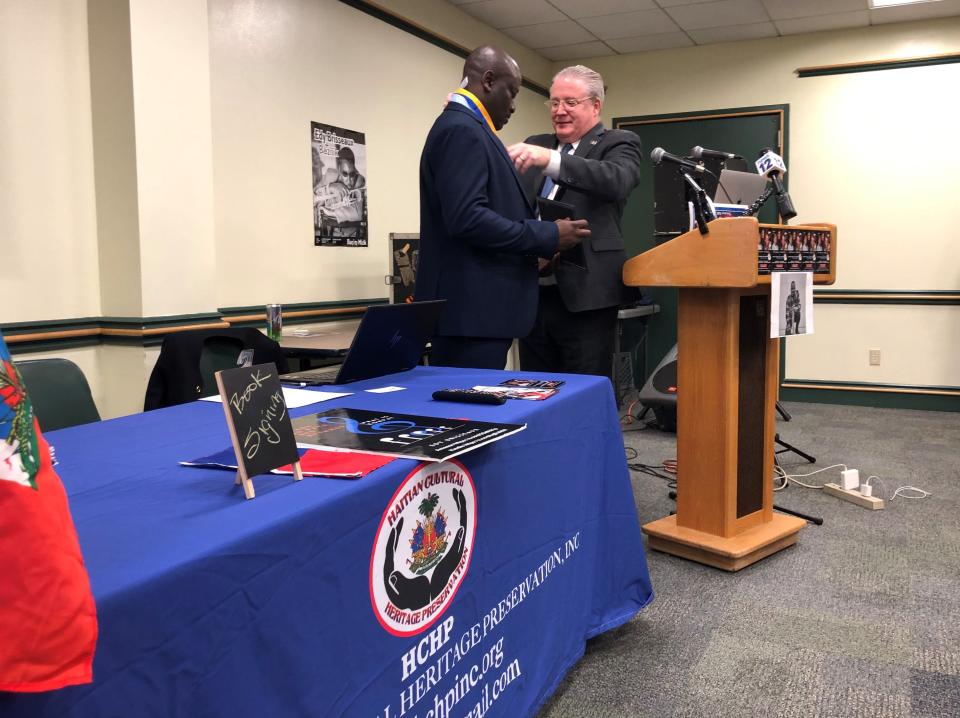 Jean Donald Mathieu, left, is presented with the New York State Senate Liberty Award by state Sen. Bill Weber on Sunday, Feb. 18, 2024, at Finkelstein Memorial Library in Spring Valley. Mathieu rescued a baby and two women from a fire on Feb. 3, 2024.