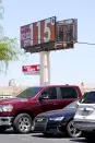 A billboard sign displays an unofficial temperature of 115-degrees Fahrenheit (46.1 Celsius) on Wednesday, July 19, 2023, in Phoenix. (AP Photo/Ross D. Franklin)