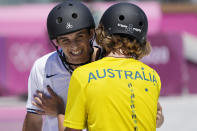 Keegan Palmer of Australia, right, embraces Cory Juneau of the United States during the men's park skateboarding finals at the 2020 Summer Olympics, Thursday, Aug. 5, 2021, in Tokyo, Japan. (AP Photo/Ben Curtis)