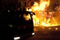 Fire crews survey a fire in Croydon, London on Monday.