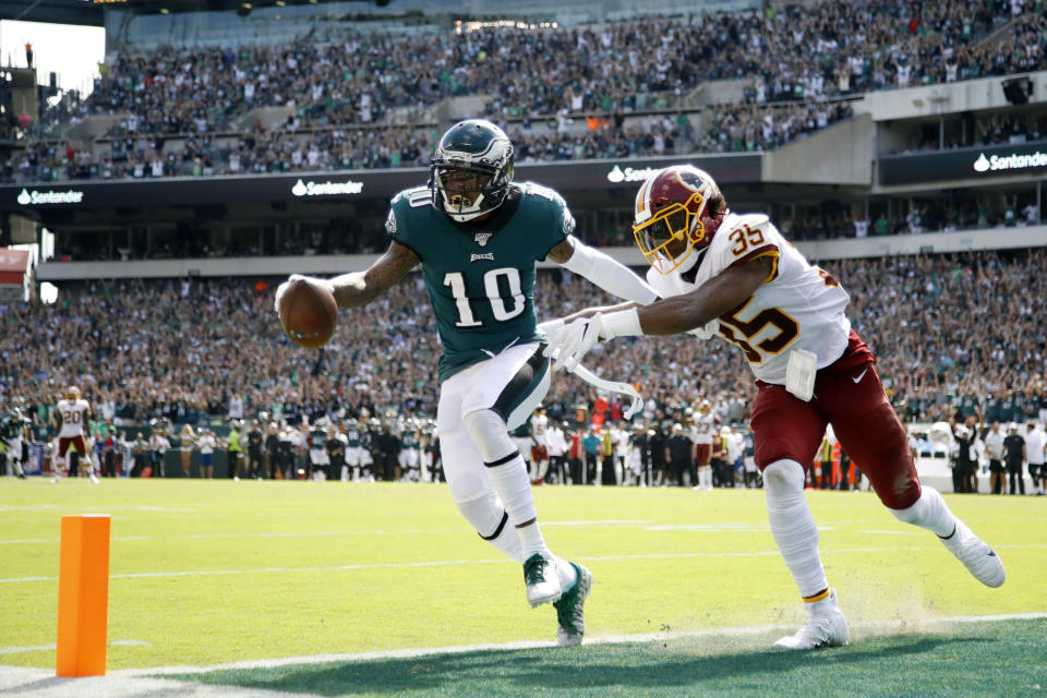 FILE - In this Sunday, Sept. 8, 2019, file photo, Philadelphia Eagles' DeSean Jackson, left, scores a touchdown against Washington Redskins' Montae Nicholson during the second half of an NFL football game in Philadelphia. Jackson’s return to Philly couldn’t have gone much better. He made eight receptions for 154 yards and a pair of 50-plus-yard TD catches in sparking the Eagles’ rally from a 17-0 hole against the Redskins. (AP Photo/Matt Rourke, File)