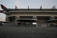 A view of the San Siro stadium where the Serie A soccer match between Inter and Sampdoria was cancelled, in Milan, Italy, Sunday, Feb. 23, 2020. In Lombardy, the hardest-hit region by the spread of the Coronavirus with 90 cases, schools and universities were ordered to stay closed in the coming days, and sporting events were canceled. Lombardy's ban on public events also extended to Masses in churches in the predominantly Roman Catholic nation. (AP Photo/Antonio Calanni)