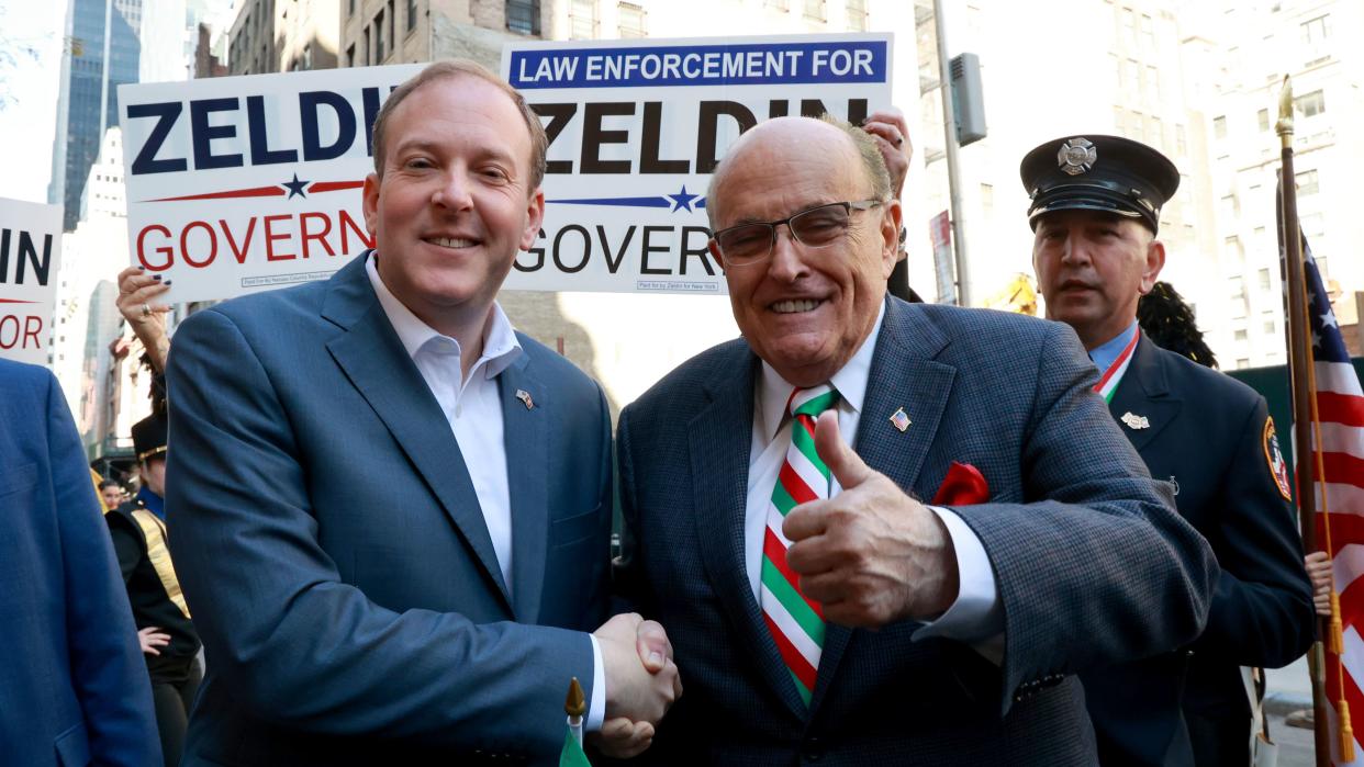 Rep. Lee Zeldin, R-NY (left) and former New York City Mayor Rudy Giuliani (right) shake hands before the start of the 78th Annual Columbus Day Parade in Manhattan, New York on Oct. 10, 2022.