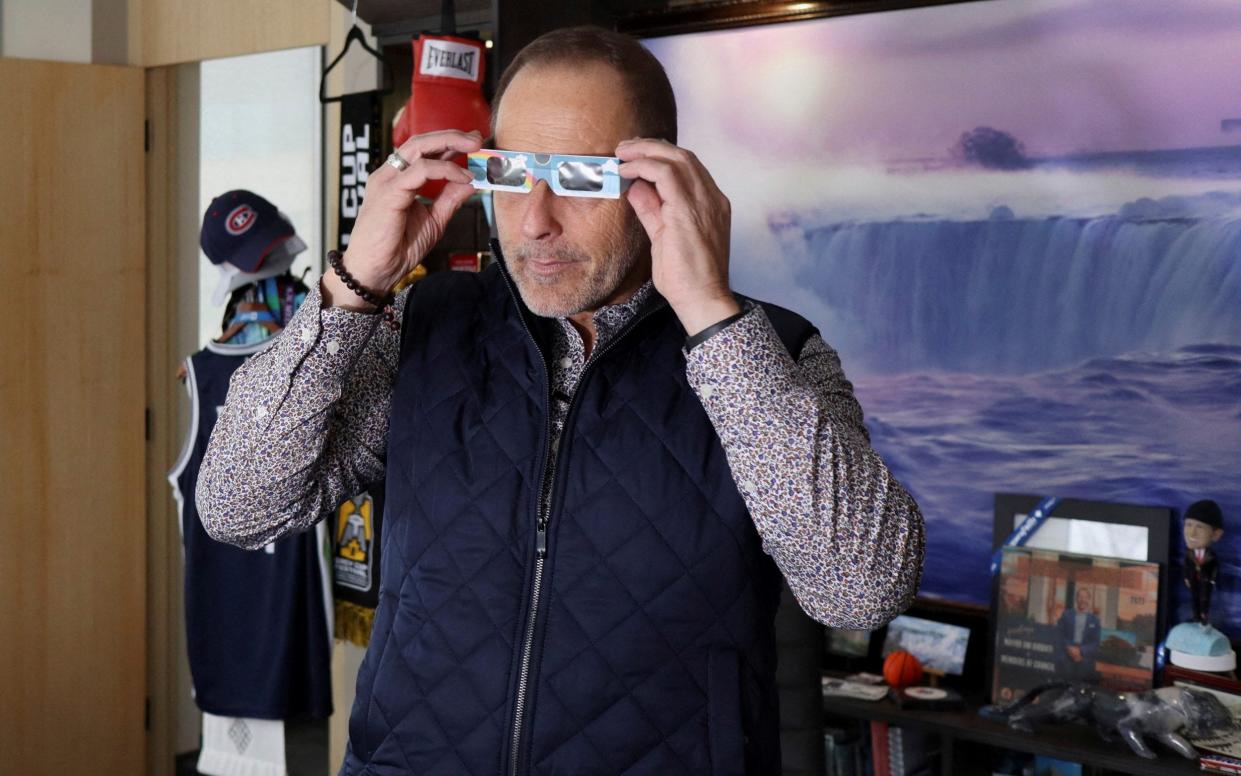 Niagara Falls mayor Jim Diodati tries out solar eclipse safety glasses