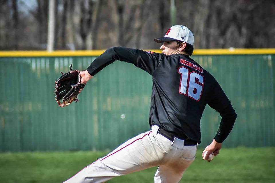 Milan's Connor Dessellier pitches earlier this season. The Big Reds won the Division 2 District at Concordia University Saturday.