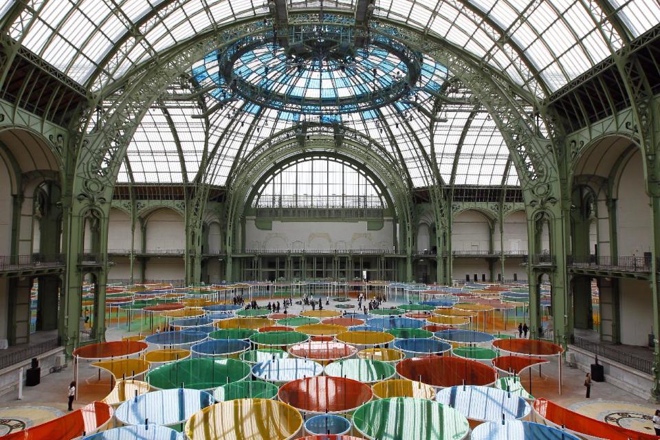 View of the creation of contemporary artist Daniel Buren in the Grand Palais during the opening of ground-breaking Monumenta exhibit in Paris, Wednesday May 9, 2012. Monumenta, the hugely-popular annual installation project that's in its fifth year, dares an artist of international statue to "move into" the nave of one of the French capital's most monumentus buildings, and own it. (AP Photo/Francois Mori)