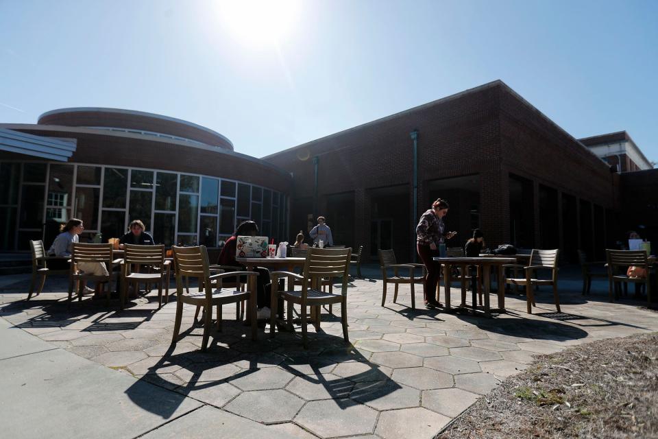 Georgia Southern students gather at an outdoor dining area on the Armstrong Campus.