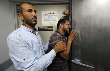 A relative of a Palestinian who was killed by Israeli troops east of Khan Younis, reacts at hospital in the central Gaza Strip July 20, 2018. REUTERS/Ibraheem Abu Mustafa