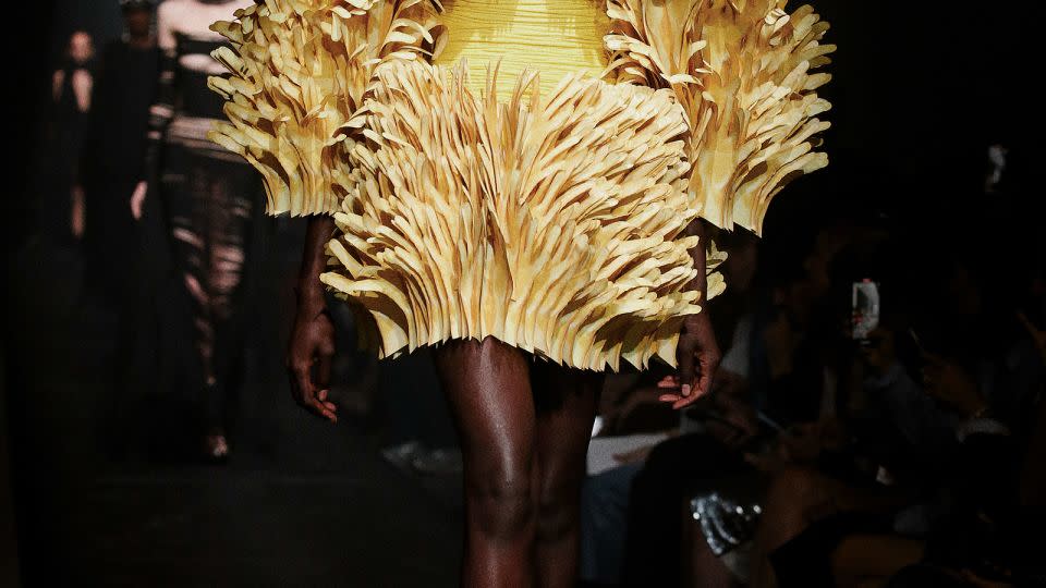 This look, too, featured hands — with thousands of layered cutouts used to form a sculptural couture dress. - Dan Lecca/Courtesy of AREA