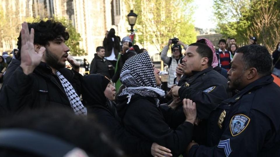 Police try to handle protesters on the campus of City College of New York