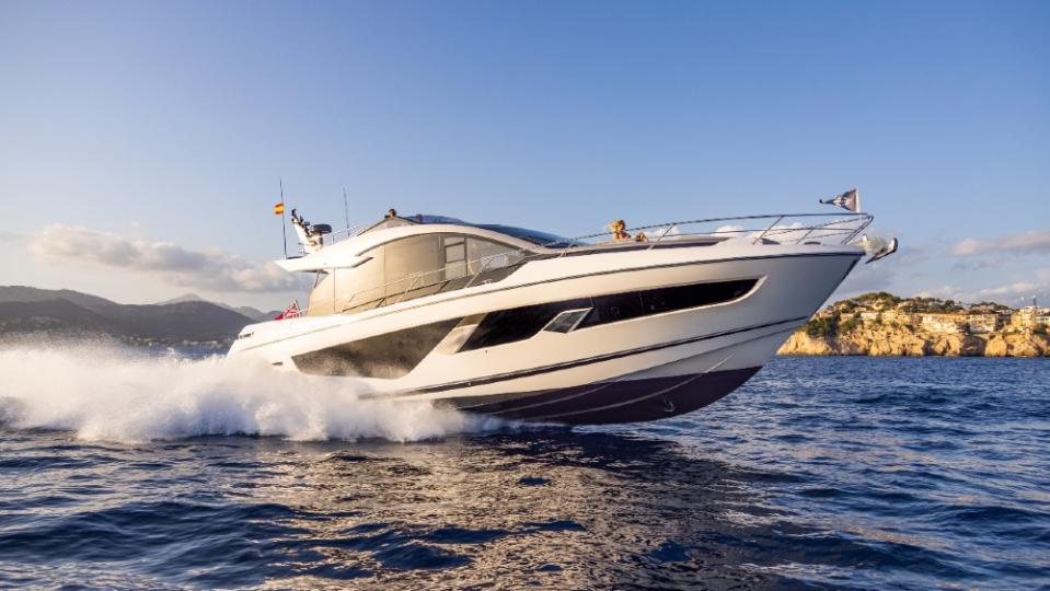 There aren’t many 65-footers that deliver this peppy ride, and while the person on the foredeck is enjoying the view, the captain on the upper deck (note small head in center) is having the most fun. - Credit: Courtesy Sunseeker Yachts