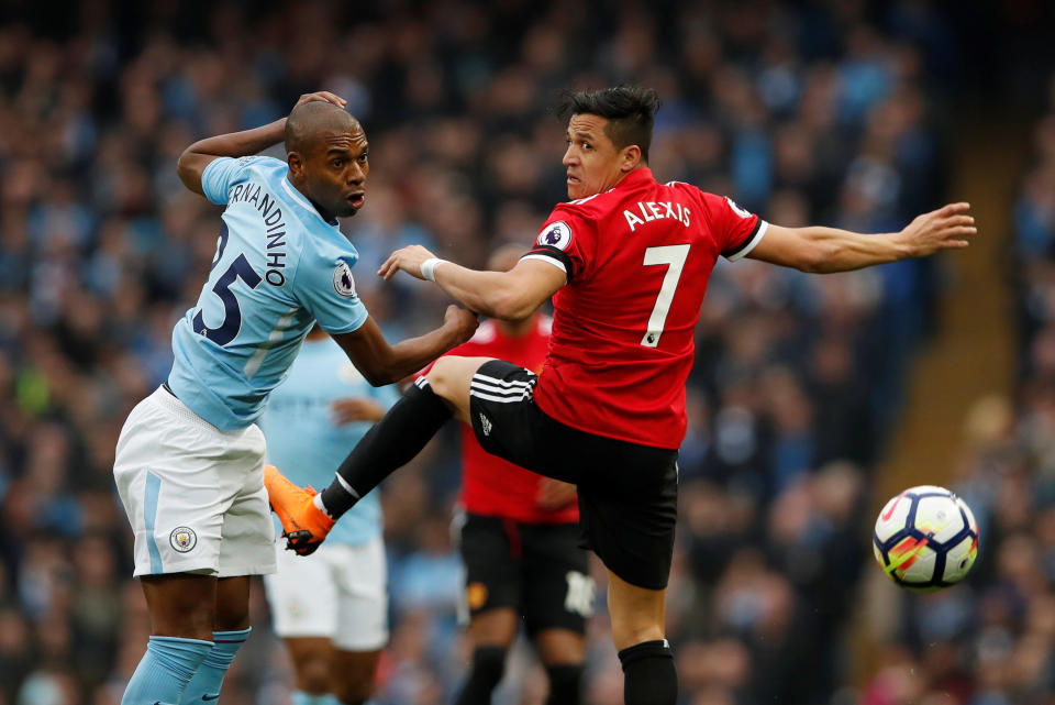 <p>Manchester United’s Alexis Sanchez attempts to thwart Manchester City’s Fernandinho </p>