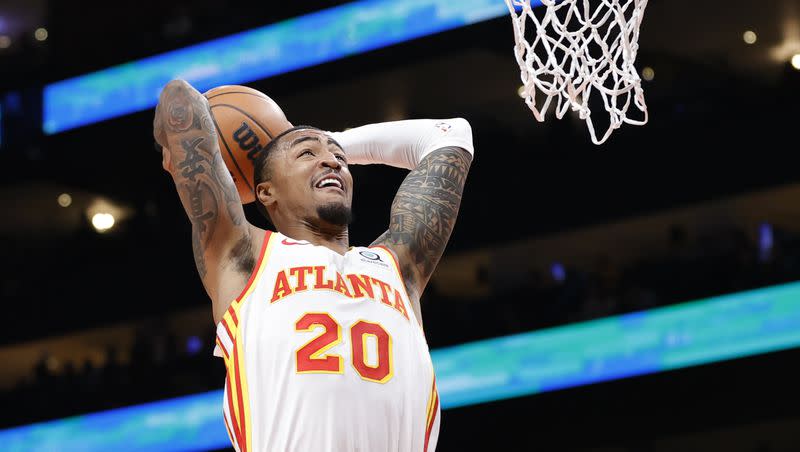 Atlanta Hawks forward John Collins (20) slam dunks the ball during the first half of an NBA basketball game against the Boston Celtics, Saturday, March 11, 2023, in Atlanta. The Utah Jazz are acquiring Collins from the Hawks, the Deseret News confirmed.