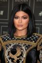 <p>Nude lipstick and a glossy center-parted bob at the Balmain for H&M event in 2015.</p>