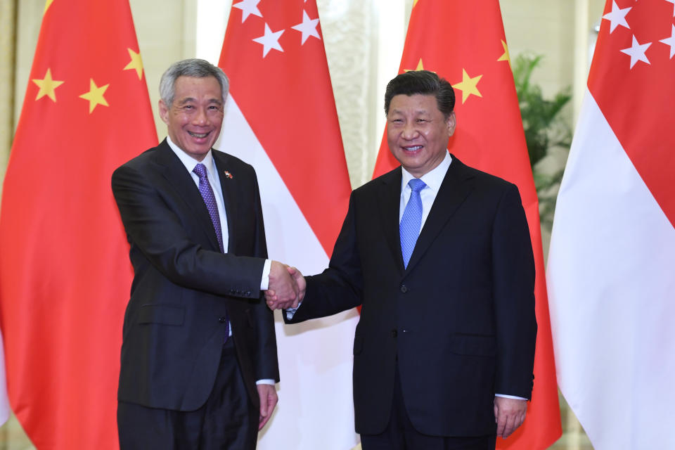 Singapore’s Prime Minister Lee Hsien Loong shakes hands with China's President Xi Jinping before their meeting at the Great Hall of the People in Beijing, China  April 29, 2019. Madoka Ikegami/Pool via REUTERS