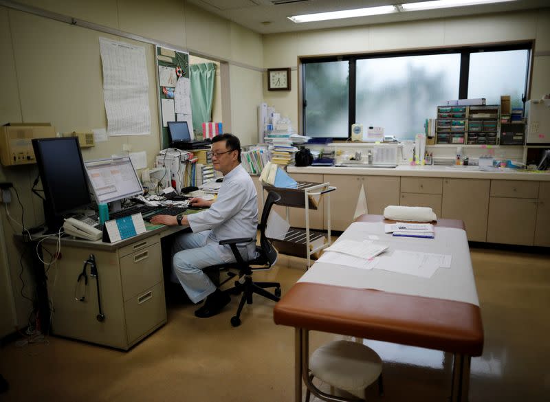 Toshihiko Yamazaki, a doctor who is also the director of the National Federation of Health Care Organizations, is seen at his urology clinic in Urawa, Japan