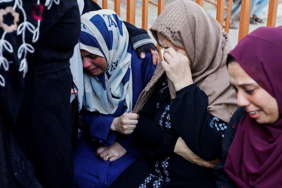 Mourners react during a funeral of Palestinians killed in Israeli strikes, in Khan Younis (REUTERS)