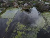 Getting rid of all the floodwater and drying out the homes in the small Ukrainian town of Demydiv looks set to be weeks away (AFP/Nicolas GARCIA)