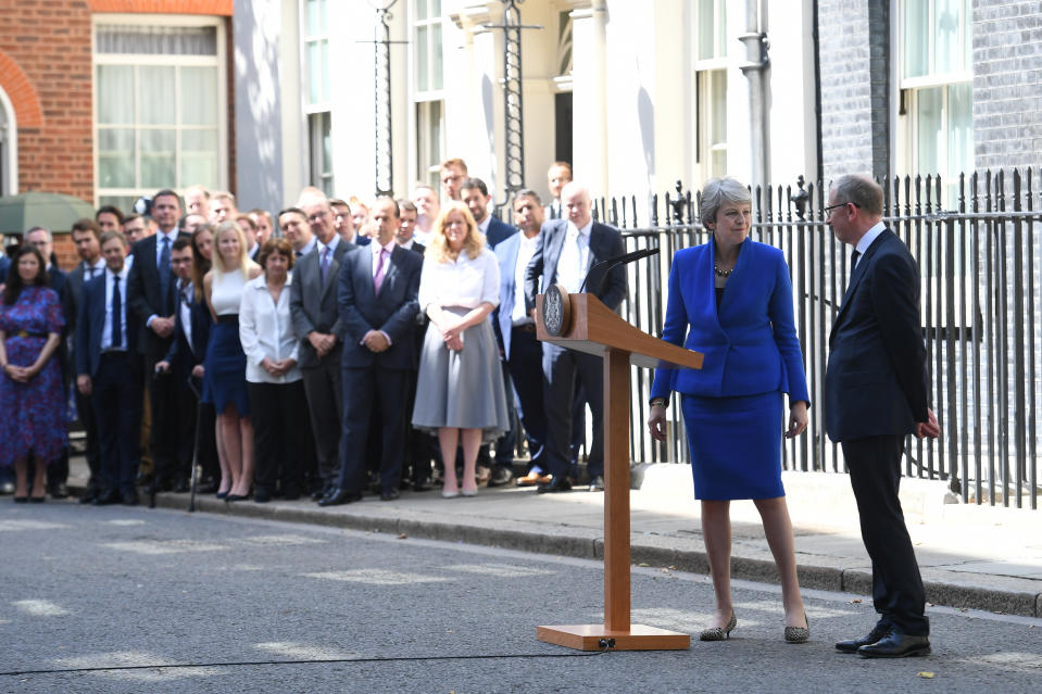 Outgoing Prime Minister Theresa May, watched by husband Philip, speaks outside 10 Downing Street, London, before a meeting at Buckingham Palace where she will hand in her resignation to Queen Elizabeth II.