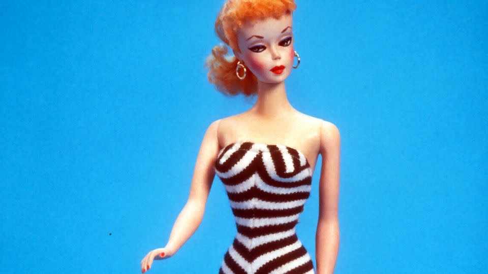 With her fitted one piece, high heels and a full face of makeup, the original Barbie offered a glamorous  take on poolside fashion. - Yvonne Hemsey/Getty Images