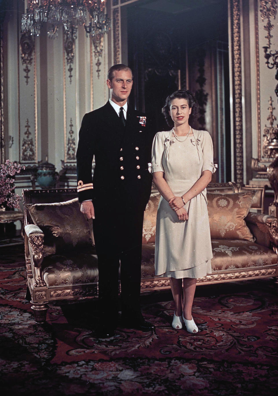 FILE - Britain's Princess Elizabeth and Lt. Philip Mountbatten pose for a photo, in London, Sept. 1947. Queen Elizabeth II will mark 70 years on the throne Sunday, Feb. 6, 2022, an unprecedented reign that has made her a symbol of stability as the United Kingdom navigated an age of uncertainty. (AP Photo, File)