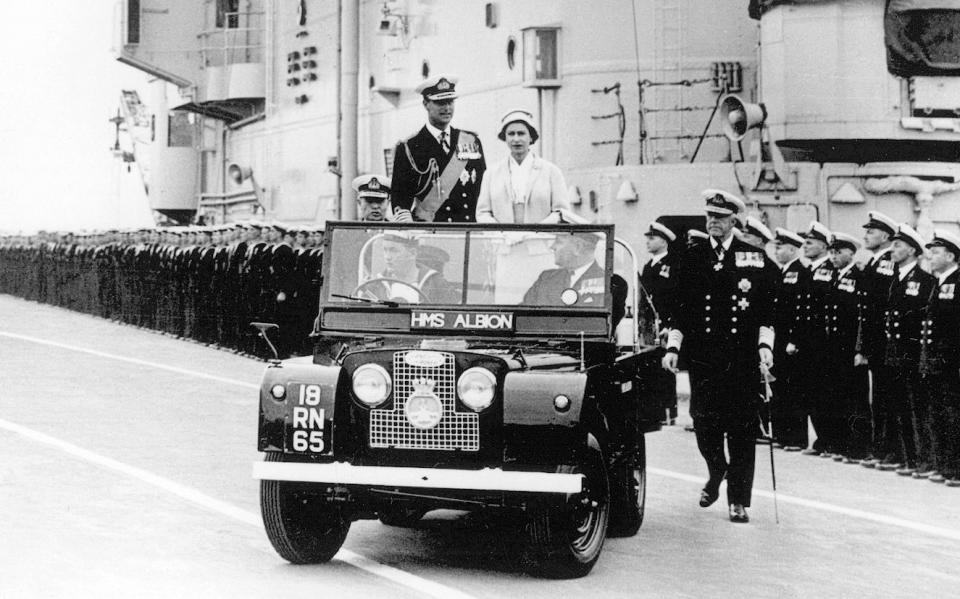 Queen Elizabeth II and The Duke of Edinburgh in a Royal Land Rover special vehicle in 1959 