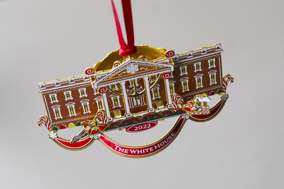 The White House Historical Association's 2022 Christmas Ornament, Tuesday, Dec 6, 2022 in Washington. The annual tree ornament is honors President Richard M. Nixon's administration and a nod to first lady Pat Nixon who first put a gingerbread house on display in the State Dining Room for the holiday season at the White House, long before its talented pastry chefs began making hundred-pound replicas of the executive mansion. (AP Photo/Pablo Martinez Monsivais)