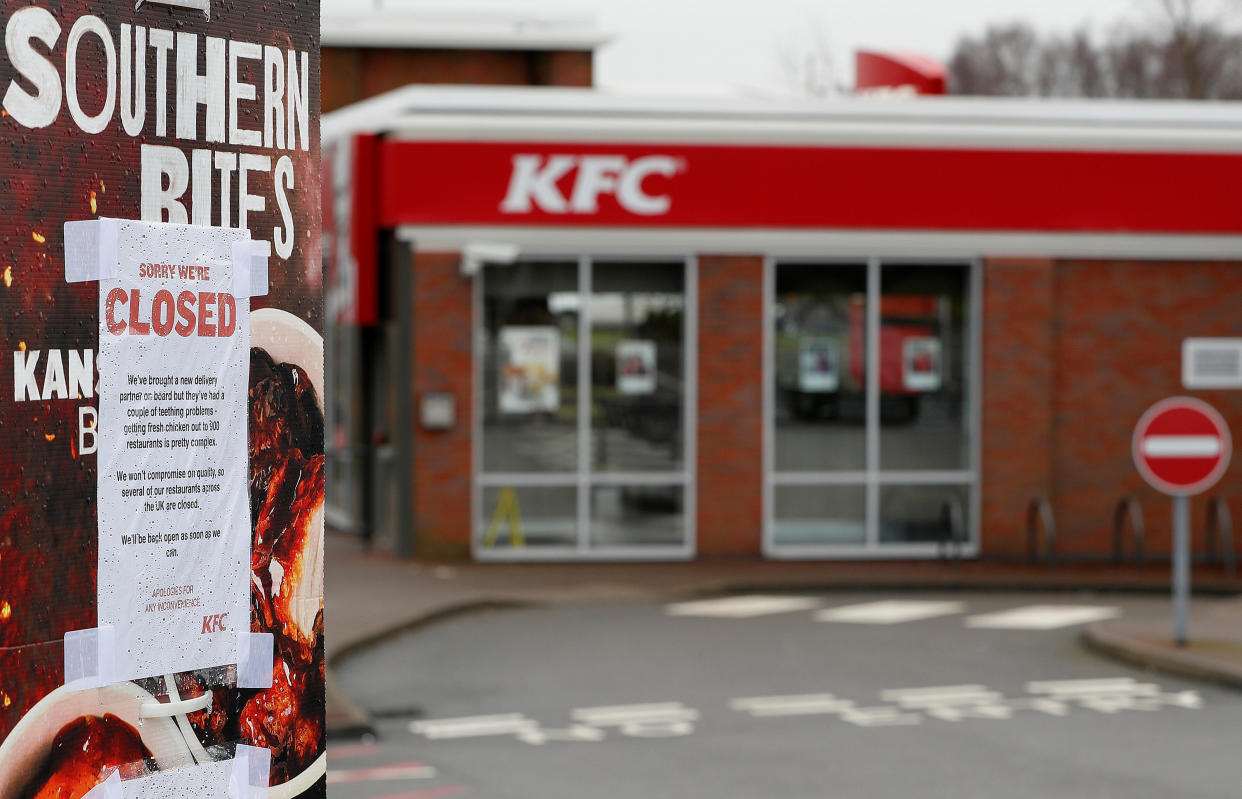 A closed sign hangs on the drive through of a KFC restaurant after problems with a new distribution system (REUTERS/Darren Staples)